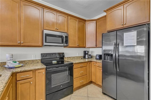 1385 Beach Blvd W, Gulf Shores, AL 36542 - kitchen with light tile floors, light stone counters, and stainless steel appliances