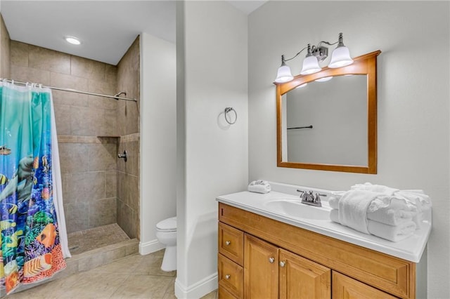 1385 Beach Blvd W, Gulf Shores, AL 36542 - bathroom featuring tile floors, walk in shower, vanity with extensive cabinet space, and toilet