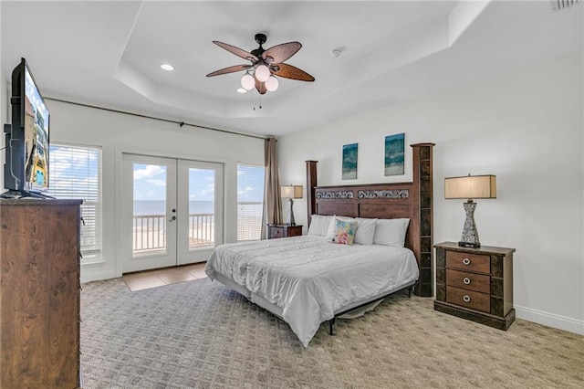 1385 Beach Blvd W, Gulf Shores, AL 36542 - carpeted bedroom with ceiling fan, a tray ceiling, french doors, and access to exterior