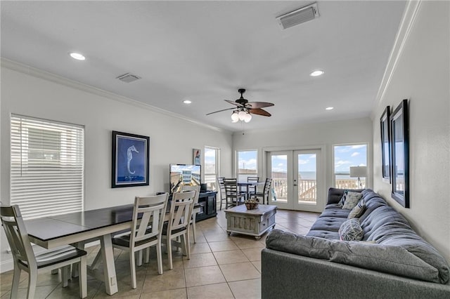 1385 Beach Blvd W, Gulf Shores, AL 36542 - living room featuring light tile floors, ornamental molding, ceiling fan, and french doors