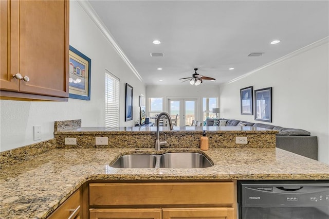 1385 Beach Blvd W, Gulf Shores, AL 36542 - kitchen with light stone countertops, sink, dishwasher, and ornamental molding