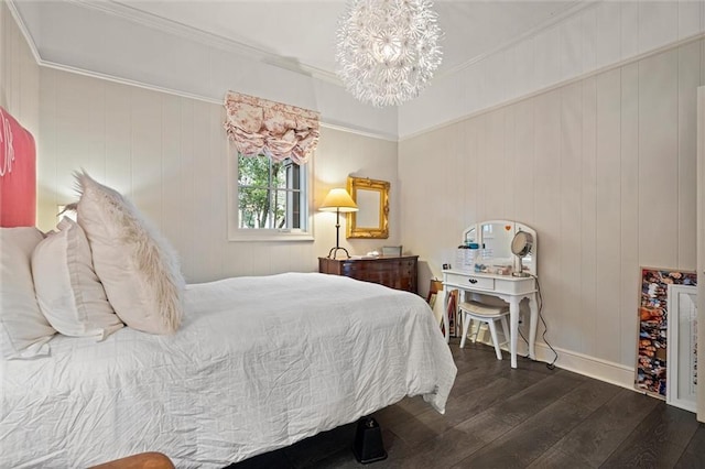 bedroom featuring a chandelier, wooden walls, dark hardwood / wood-style floors, and ornamental molding