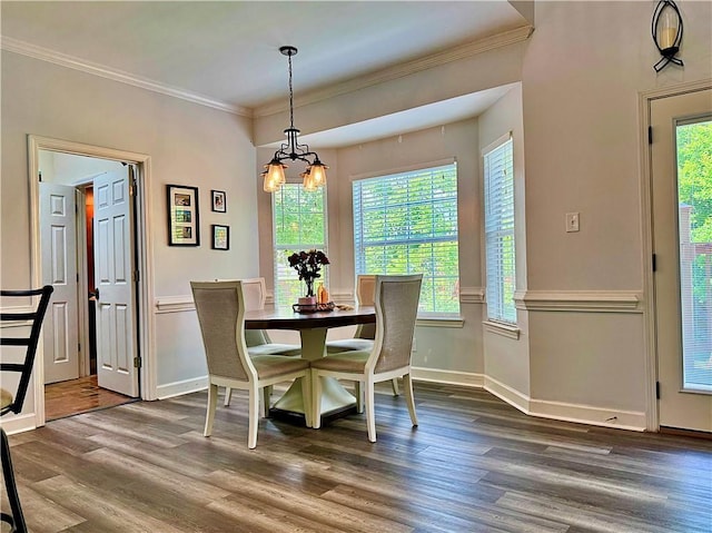 2200 Orourke Dr, Mobile, AL 36695 - dining room with dark wood-style flooring, crown molding, a chandelier, and baseboards