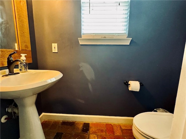 2200 Orourke Dr, Mobile, AL 36695 - half bathroom with baseboards and toilet