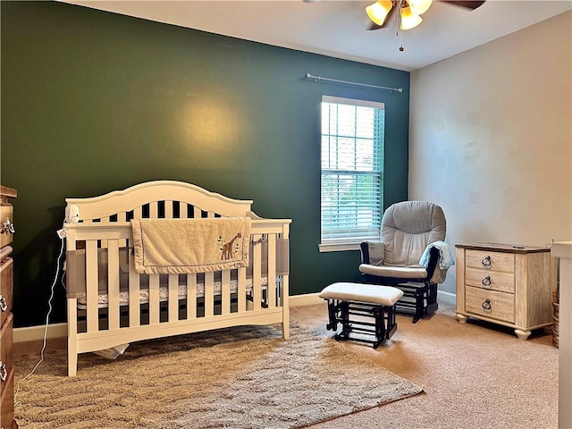 2200 Orourke Dr, Mobile, AL 36695 - carpeted bedroom with a crib and baseboards