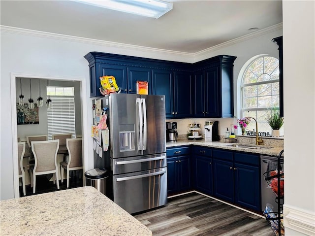 2200 Orourke Dr, Mobile, AL 36695 - kitchen featuring stainless steel appliances, blue cabinets, a sink, healthy amount of natural light, and crown molding
