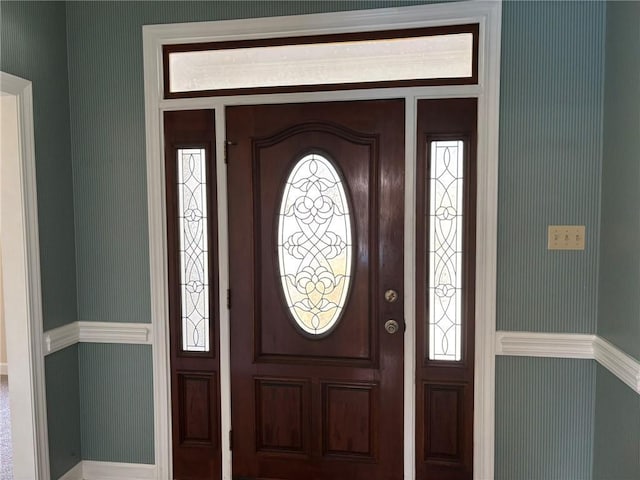 foyer with wallpapered walls