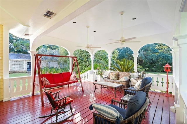 26 Julia St S, Mobile, AL 36604 - wooden deck with an outdoor living space and a ceiling fan