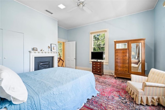 26 Julia St S, Mobile, AL 36604 - bedroom featuring a ceiling fan, baseboards, and a fireplace