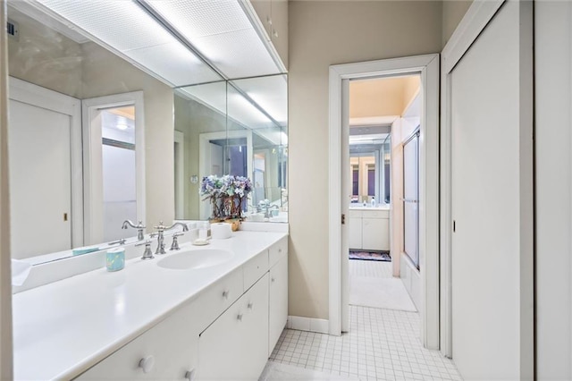 26 Julia St S, Mobile, AL 36604 - bathroom with vanity, an enclosed shower, baseboards, and tile patterned floors