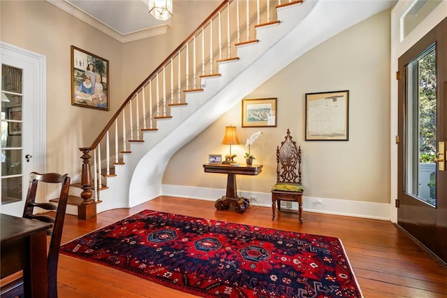 26 Julia St S, Mobile, AL 36604 - foyer entrance with hardwood / wood-style floors, stairs, baseboards, and crown molding