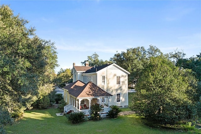 26 Julia St S, Mobile, AL 36604 - view of property exterior featuring a porch, a yard, and a chimney