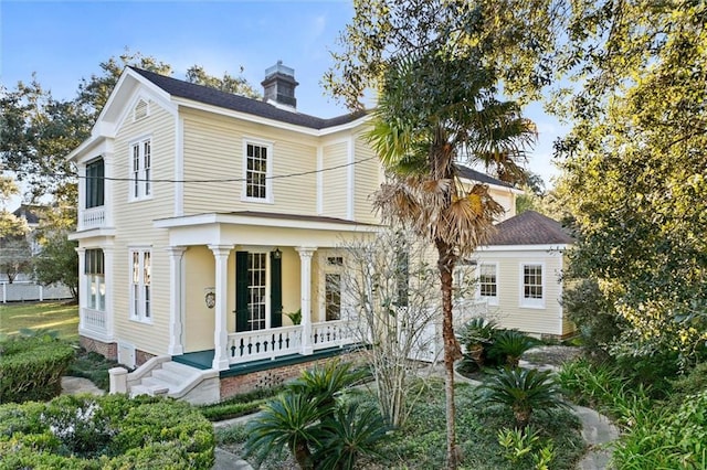 26 Julia St S, Mobile, AL 36604 - view of front of house featuring a porch and a chimney
