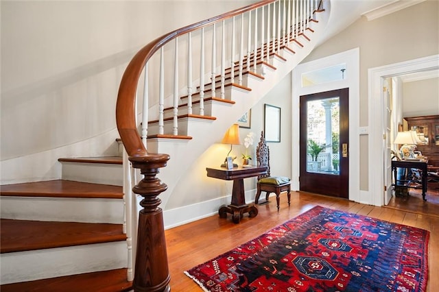 26 Julia St S, Mobile, AL 36604 - entrance foyer with stairway, hardwood / wood-style flooring, crown molding, and baseboards