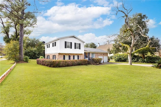 view of front of home featuring a garage and a front lawn