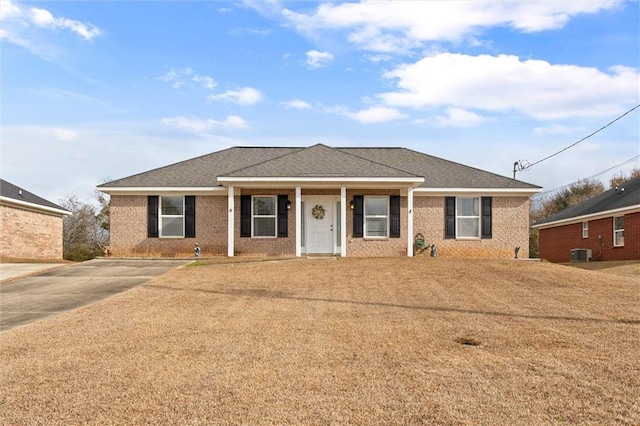 ranch-style home with central air condition unit