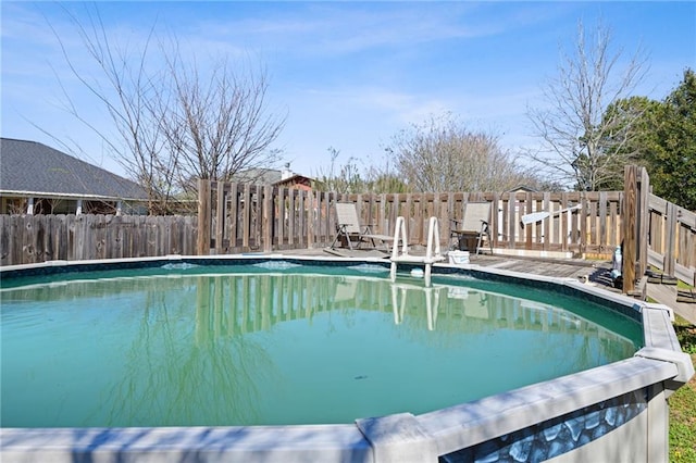 view of swimming pool featuring fence and a fenced in pool