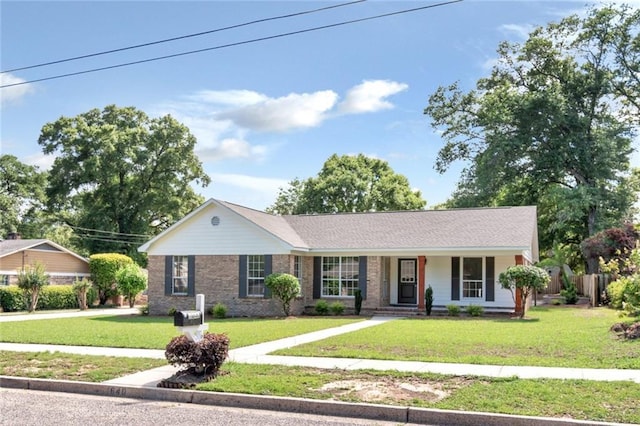 single story home with a porch and brick siding