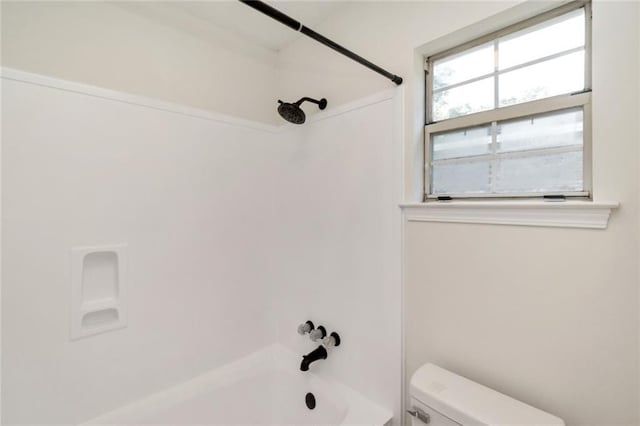 bathroom with toilet and shower / bath combination