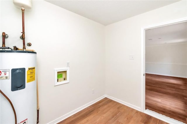utility room featuring electric water heater