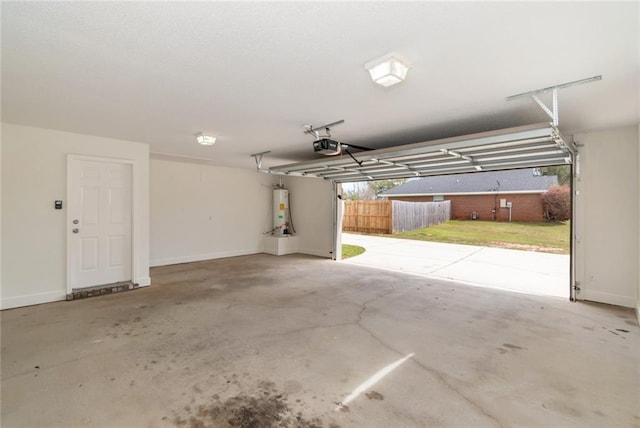 garage with a garage door opener, water heater, and baseboards