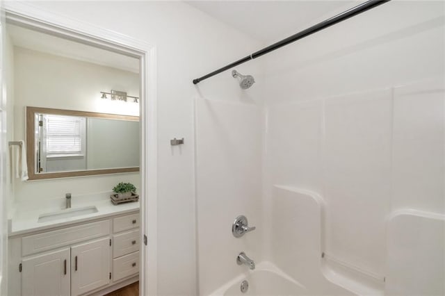 bathroom featuring vanity and shower / washtub combination