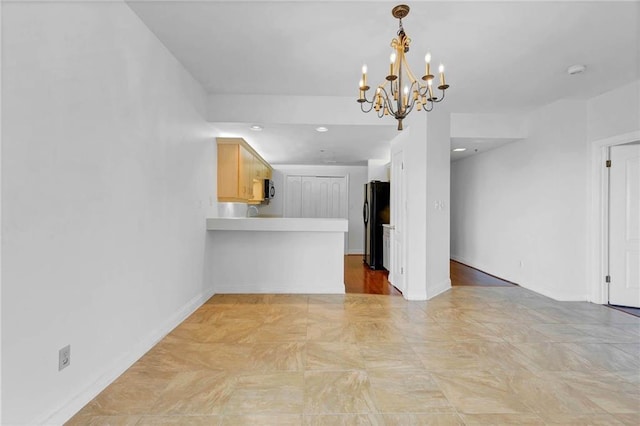 100 Tower Dr Unit 704, Daphne, AL 36526 - unfurnished living room with a chandelier and baseboards