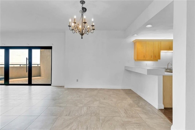 100 Tower Dr Unit 704, Daphne, AL 36526 - unfurnished dining area with a sink and a chandelier