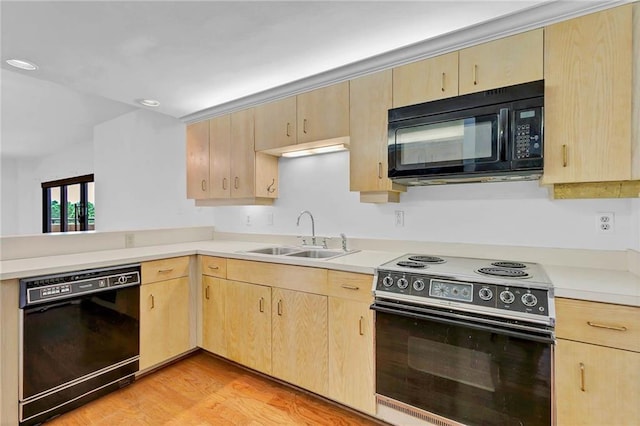 100 Tower Dr Unit 704, Daphne, AL 36526 - kitchen featuring black appliances, light brown cabinetry, light countertops, light wood-style floors, and recessed lighting