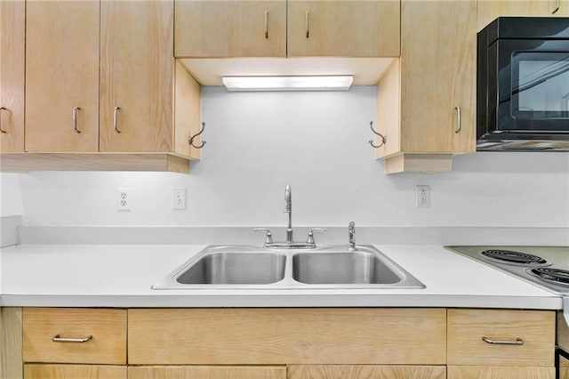 100 Tower Dr Unit 704, Daphne, AL 36526 - kitchen featuring black microwave, light brown cabinets, light countertops, and stove