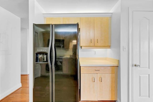 100 Tower Dr Unit 704, Daphne, AL 36526 - kitchen with refrigerator with ice dispenser, light brown cabinetry, light wood finished floors, and light countertops