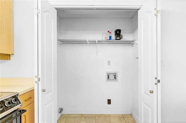 100 Tower Dr Unit 704, Daphne, AL 36526 - laundry room featuring baseboards and washer hookup