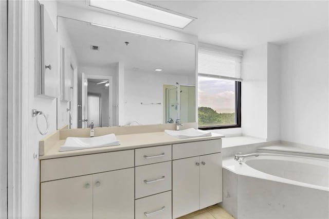 100 Tower Dr Unit 704, Daphne, AL 36526 - bathroom with a bath, double vanity, a stall shower, and tile patterned floors