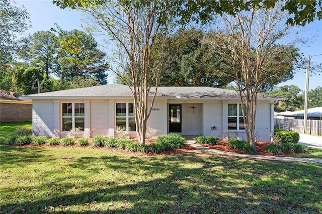 view of front of property with a front lawn