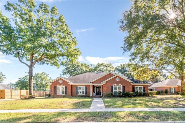 single story home with a front lawn