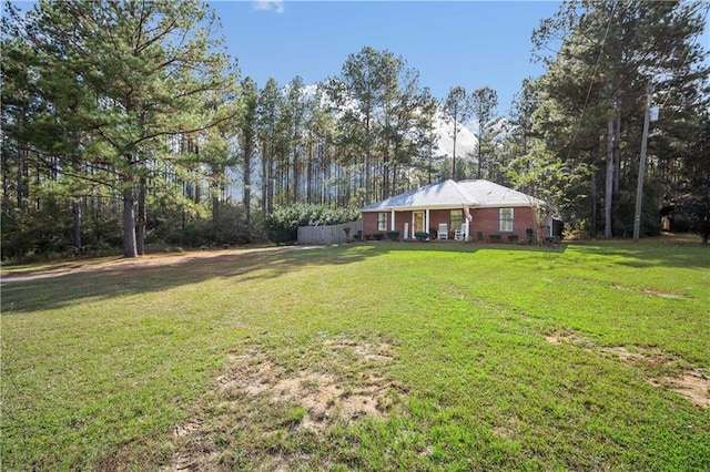 view of yard with covered porch