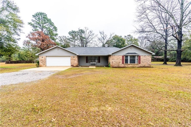 ranch-style home with a front yard and a garage