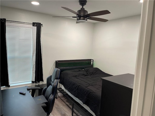 bedroom featuring wood-type flooring and ceiling fan