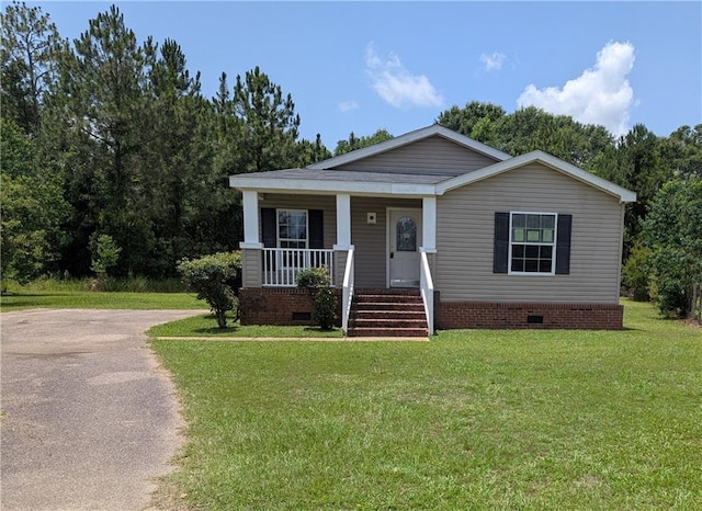 6960 March Pointe Ct, Theodore, AL 36582 - view of front of house with crawl space, a porch, and a front lawn