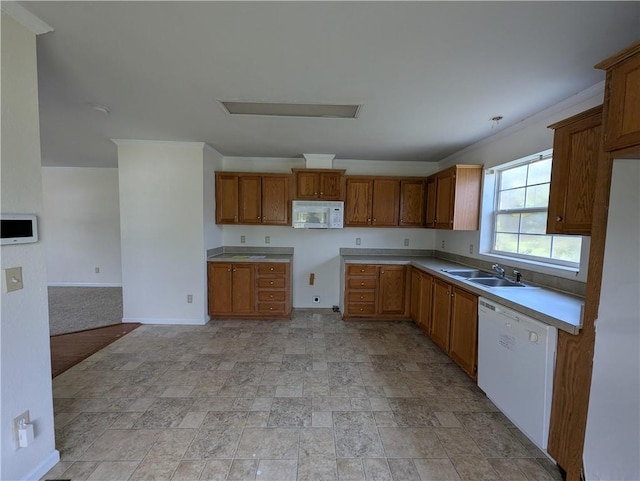 6960 March Pointe Ct, Theodore, AL 36582 - kitchen with white appliances, brown cabinetry, stone finish flooring, and light countertops
