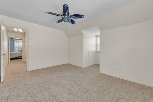 bonus room with carpet, ceiling fan, vaulted ceiling, and baseboards