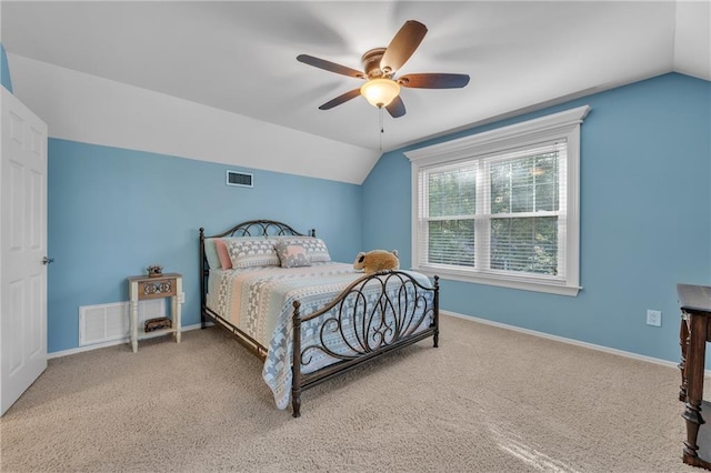 carpeted bedroom with baseboards, visible vents, ceiling fan, and lofted ceiling