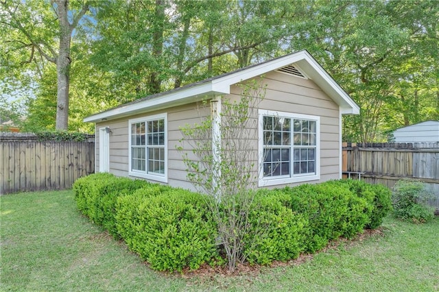 view of outbuilding with a fenced backyard