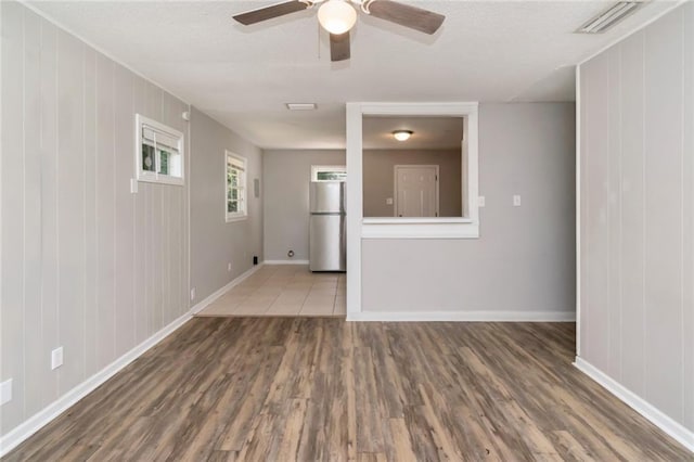 6451 Barker Dr S, Mobile, AL 36608 - empty room with wood finished floors, baseboards, and a ceiling fan