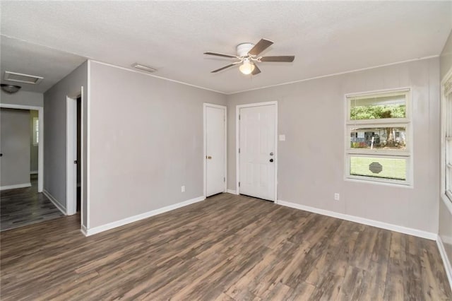 6451 Barker Dr S, Mobile, AL 36608 - empty room with wood finished floors, baseboards, a ceiling fan, attic access, and a textured ceiling