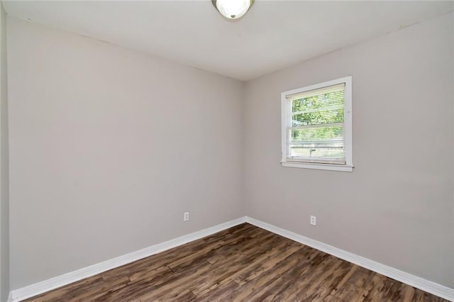 6451 Barker Dr S, Mobile, AL 36608 - unfurnished room featuring baseboards and dark wood-style floors