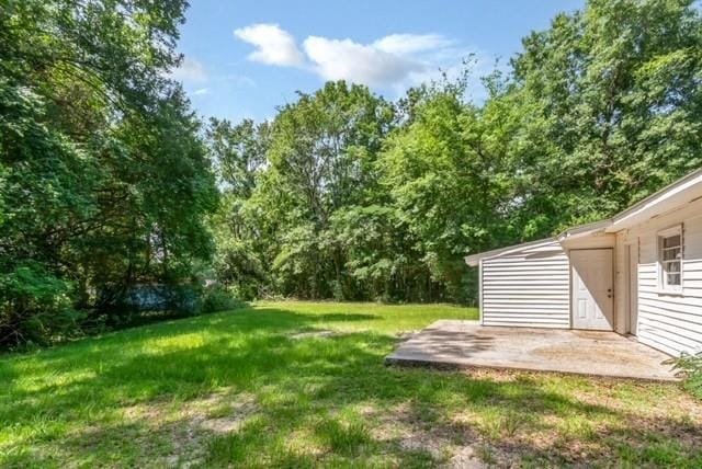 6451 Barker Dr S, Mobile, AL 36608 - view of grassy yard featuring a patio area