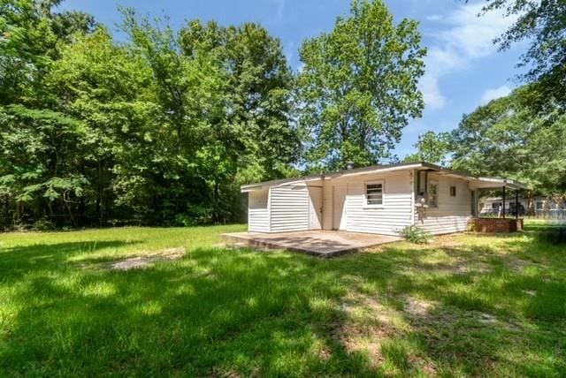 6451 Barker Dr S, Mobile, AL 36608 - view of grassy yard with a patio