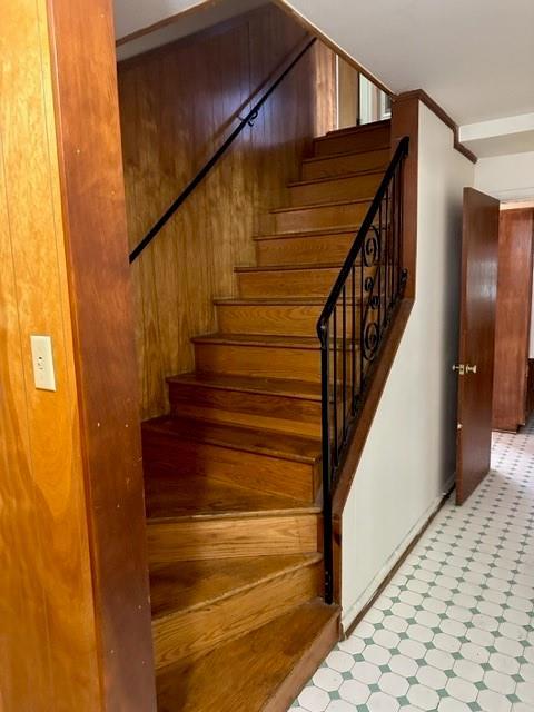 stairway with wooden walls