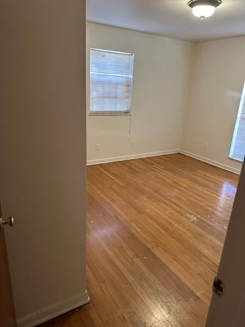 empty room featuring hardwood / wood-style flooring